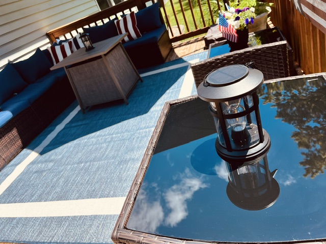 Patriotic deck seating with warm copper tones and American flag decor